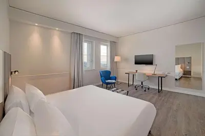 Letto o letti in una camera di NH Napoli Panorama