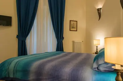 Letto o letti in una camera di B&B Univercity