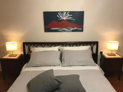 Letto o letti in una camera di Magione Serra , dimora partenopea