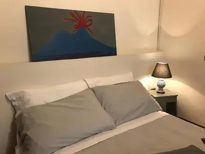 Letto o letti in una camera di Magione Serra , dimora partenopea