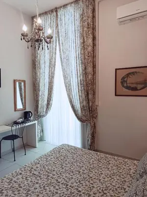 Letto o letti in una camera di B&B Dei Decumani