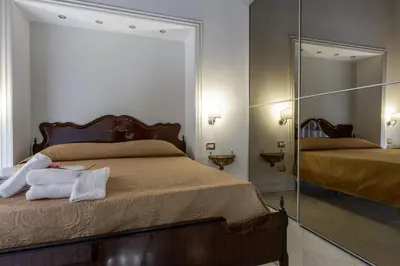 Letto o letti in una camera di Edoardo al Plebiscito