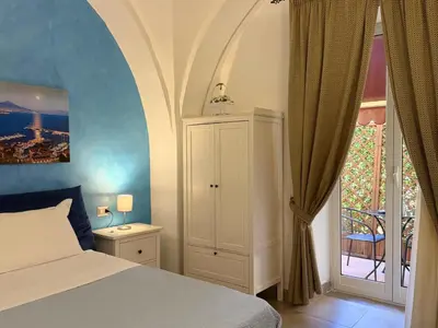 Letto o letti in una camera di Chiaia Suites