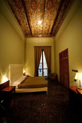 Letto o letti in una camera di Le Stanze Del Vicerè Boutique Hotel