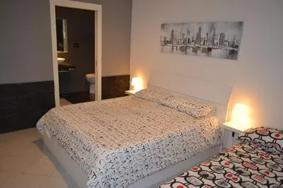 Letto o letti in una camera di HomeNapoli