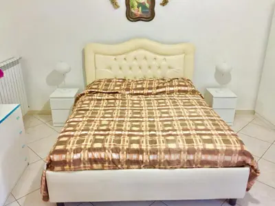 Letto o letti in una camera di Miseria e Nobiltà Apartment CHECK-IN FROM 12 00 TO 15 00