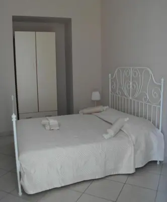 Letto o letti in una camera di A due passi da Dante