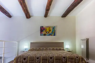 Letto o letti in una camera di Vertecoeli Home