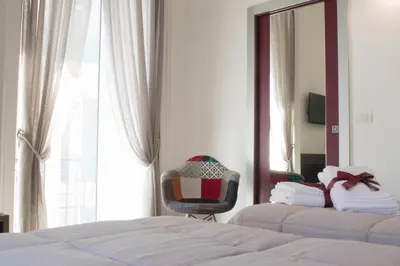 Letto o letti in una camera di Fourooms Museo Filangieri By Dimorra