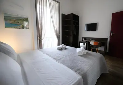 Letto o letti in una camera di Fourooms Museo Filangieri By Dimorra