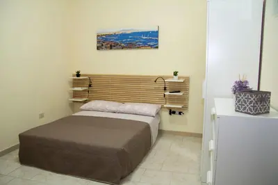 Letto o letti in una camera di Angelo's House