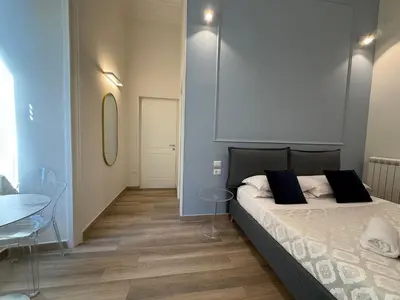 Letto o letti in una camera di Sun Art Naples Rooms