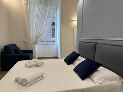Letto o letti in una camera di Sun Art Naples Rooms