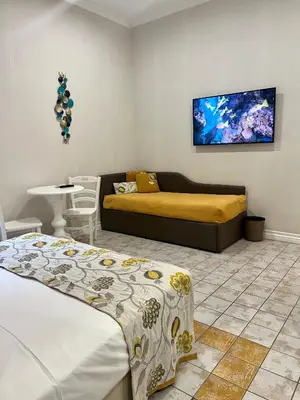 Letto o letti in una camera di Certosa Suite