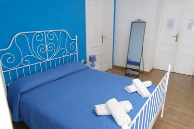 Letto o letti in una camera di B&B Tarumbò