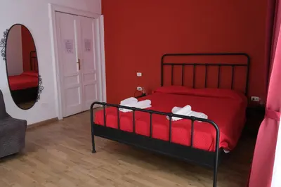 Letto o letti in una camera di B&B Tarumbò
