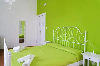Letto o letti in una camera di B&B Tarumbò