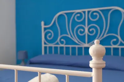 Letto o letti in una camera di B&B Tarumbò