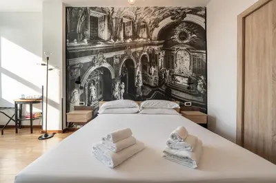 Letto o letti in una camera di De Gasperi 55