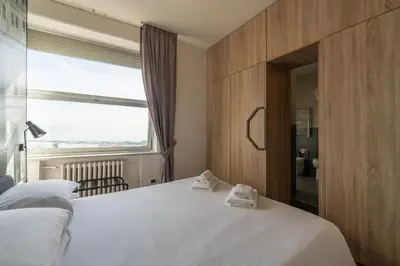 Letto o letti in una camera di De Gasperi 55