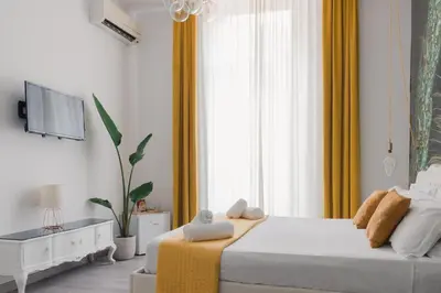 Letto o letti in una camera di Palazzo Chiatamone