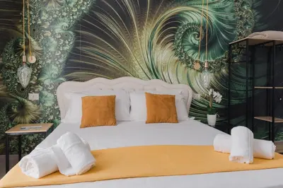 Letto o letti in una camera di Palazzo Chiatamone