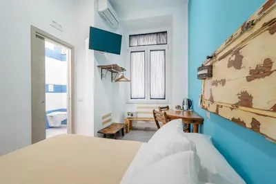 Letto o letti in una camera di B&B DolceVita Napoli