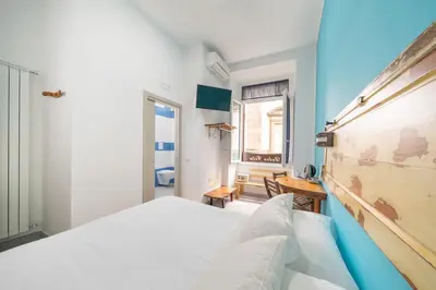 Letto o letti in una camera di B&B DolceVita Napoli