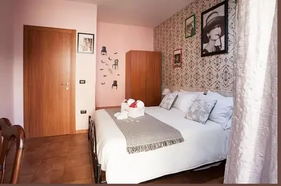 Letto o letti in una camera di Hotel Cineholiday