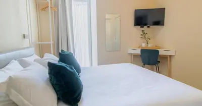 Letto o letti in una camera di Musto Suites & Rooms