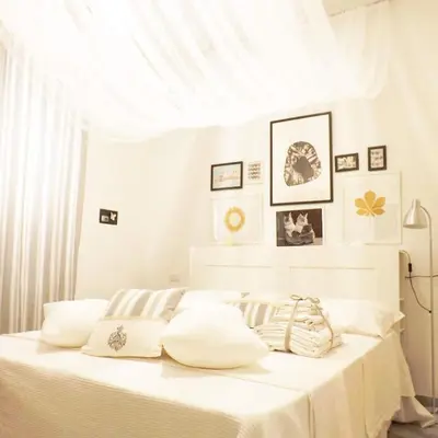 Letto o letti in una camera di Domus Alma