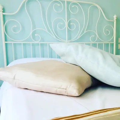 Letto o letti in una camera di Domus Alma