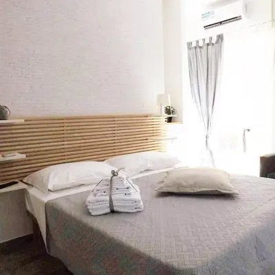 Letto o letti in una camera di Domus Alma