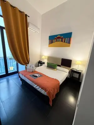 Letto o letti in una camera di Hotel Plebiscito Aparthotel