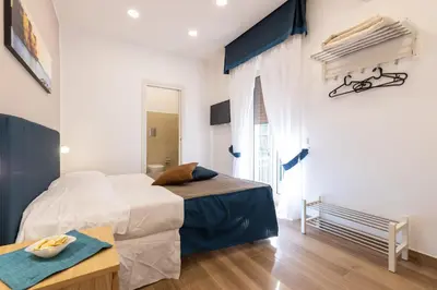 Letto o letti in una camera di Napolilive B&B