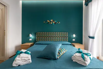 Letto o letti in una camera di Napolilive B&B