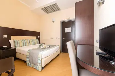 Letto o letti in una camera di Hotel Naples
