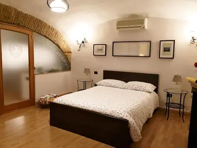Letto o letti in una camera di L' Arcata a Montesanto