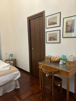 Letto o letti in una camera di Folle Città B&B