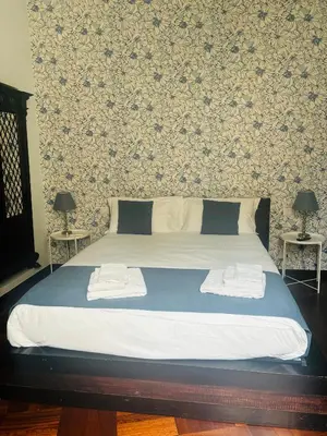 Letto o letti in una camera di Folle Città B&B