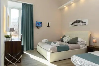 Letto o letti in una camera di Domus Angioina