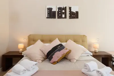 Letto o letti in una camera di Domus Angioina