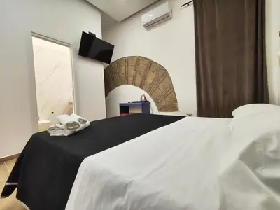 Letto o letti in una camera di Maison Arena