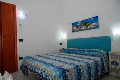 Letto o letti in una camera di Palazzo Carafa della Spina