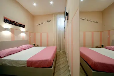 Letto o letti in una camera di B&B Residenza Alba