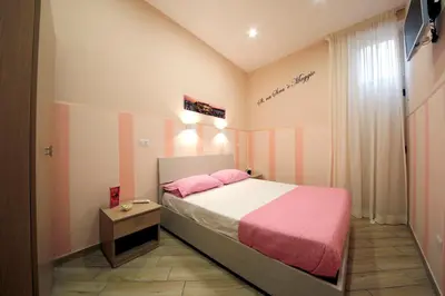 Letto o letti in una camera di B&B Residenza Alba