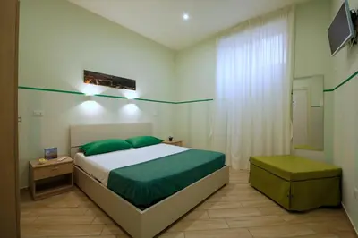 Letto o letti in una camera di B&B Residenza Alba