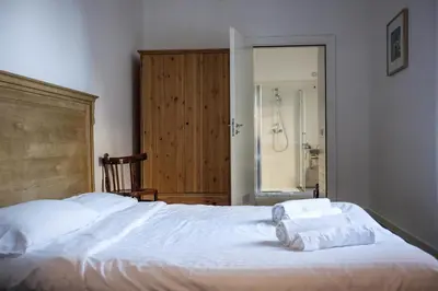 Letto o letti in una camera di La Controra Hostel Naples