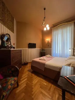 Letto o letti in una camera di B&B Michelangelo