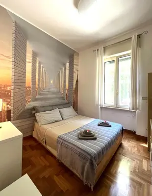 Letto o letti in una camera di B&B Michelangelo